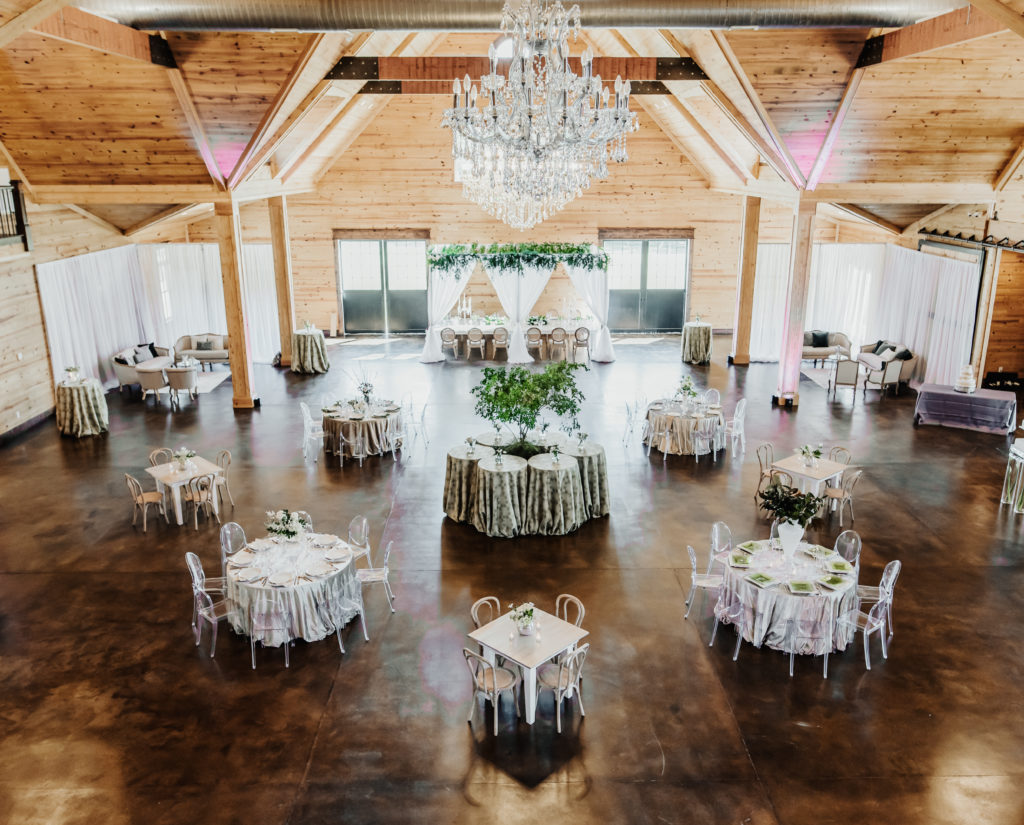 The Carolina Barn at McCormick Farms, mixed seating with Ghost chairs, velvet linens, green & white color palette, crystal chandeliers, textured linen, 