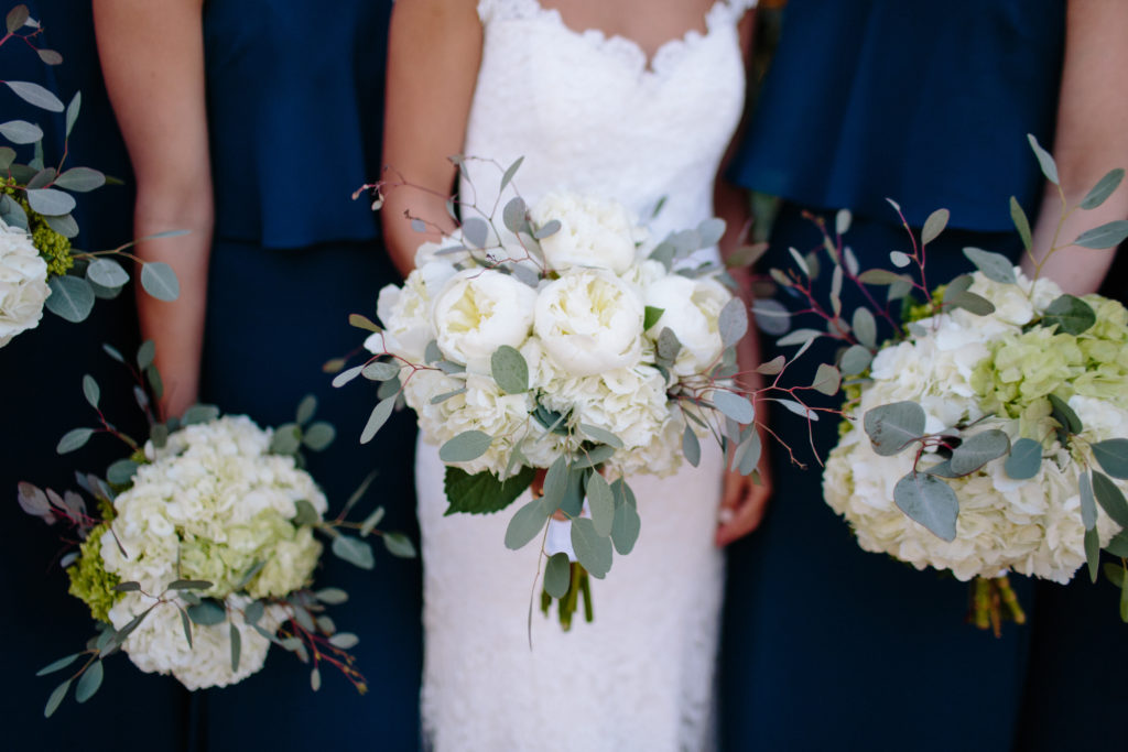 bride and bridesmaids bouquets with peonies and eucalyptus